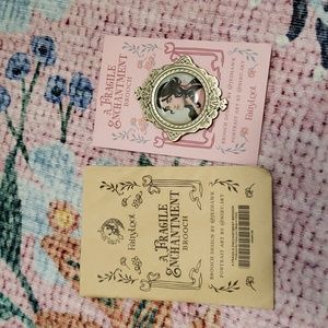 A fragile enchantment brooch